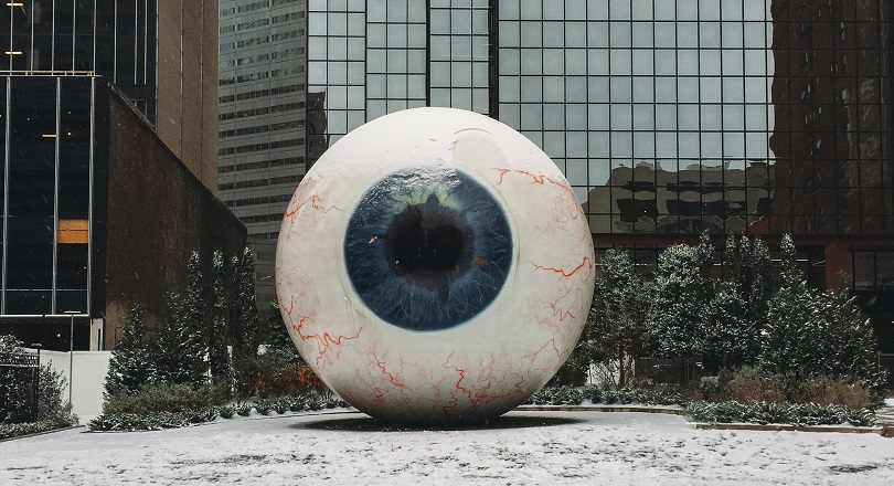 White and blue eye state in front of a building - Photo by Matthew T Rader on Unsplash